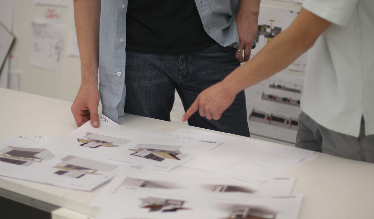 Watson team members reviewing console workstation sketch